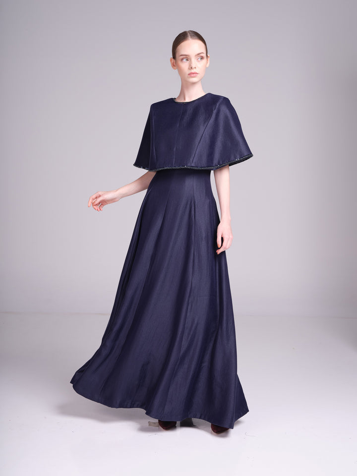 blue cape evening gown with beaded neckline and cape trim