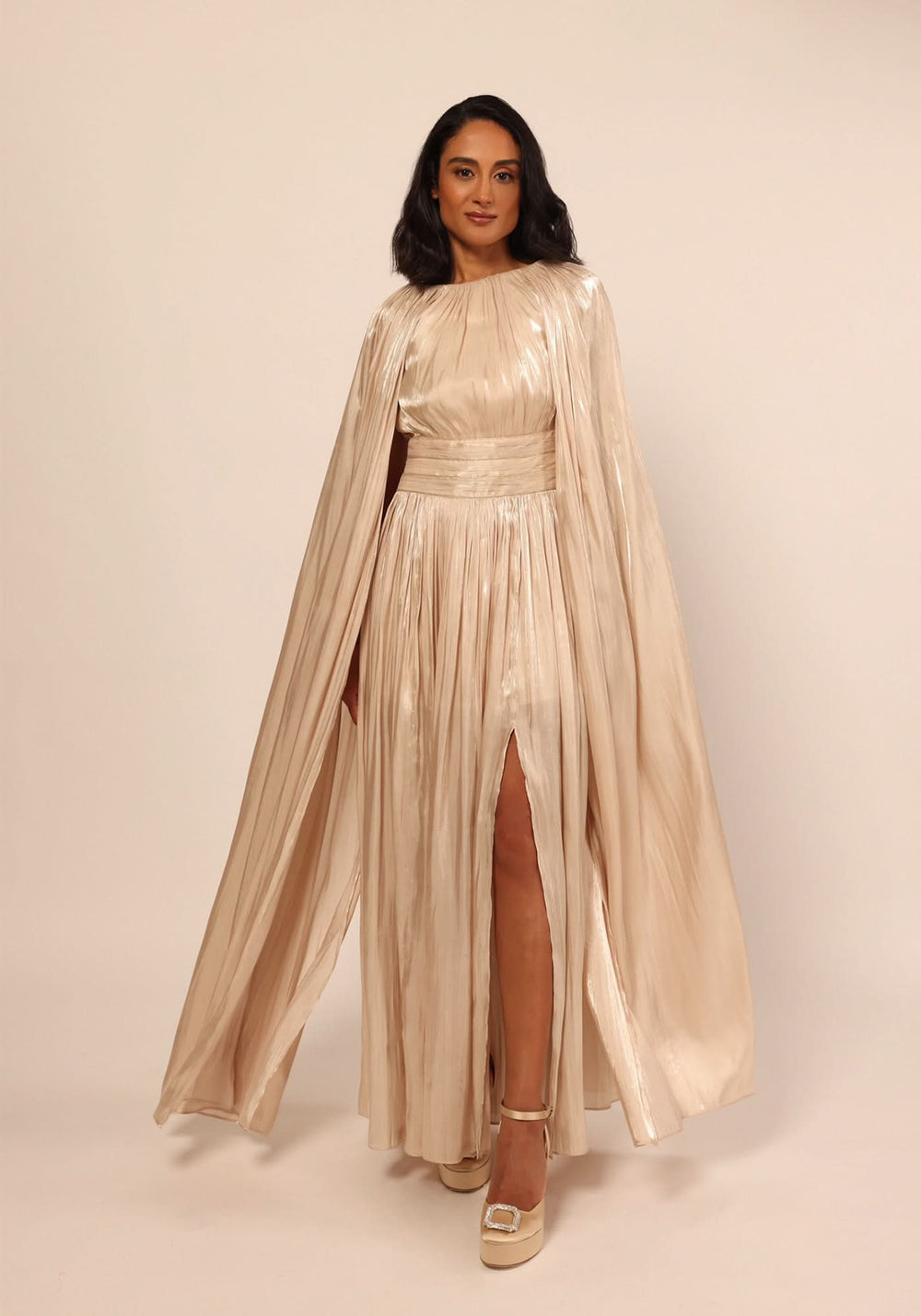 Basima Dress in beige, cape sleeve taffeta gown with a gathered neckline and piped waistband, by Baruni
