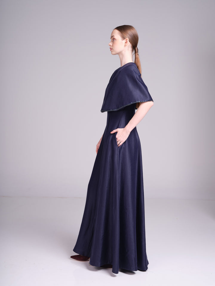 Alya navy blue wedding guest maxi dress with fitted waist and cape