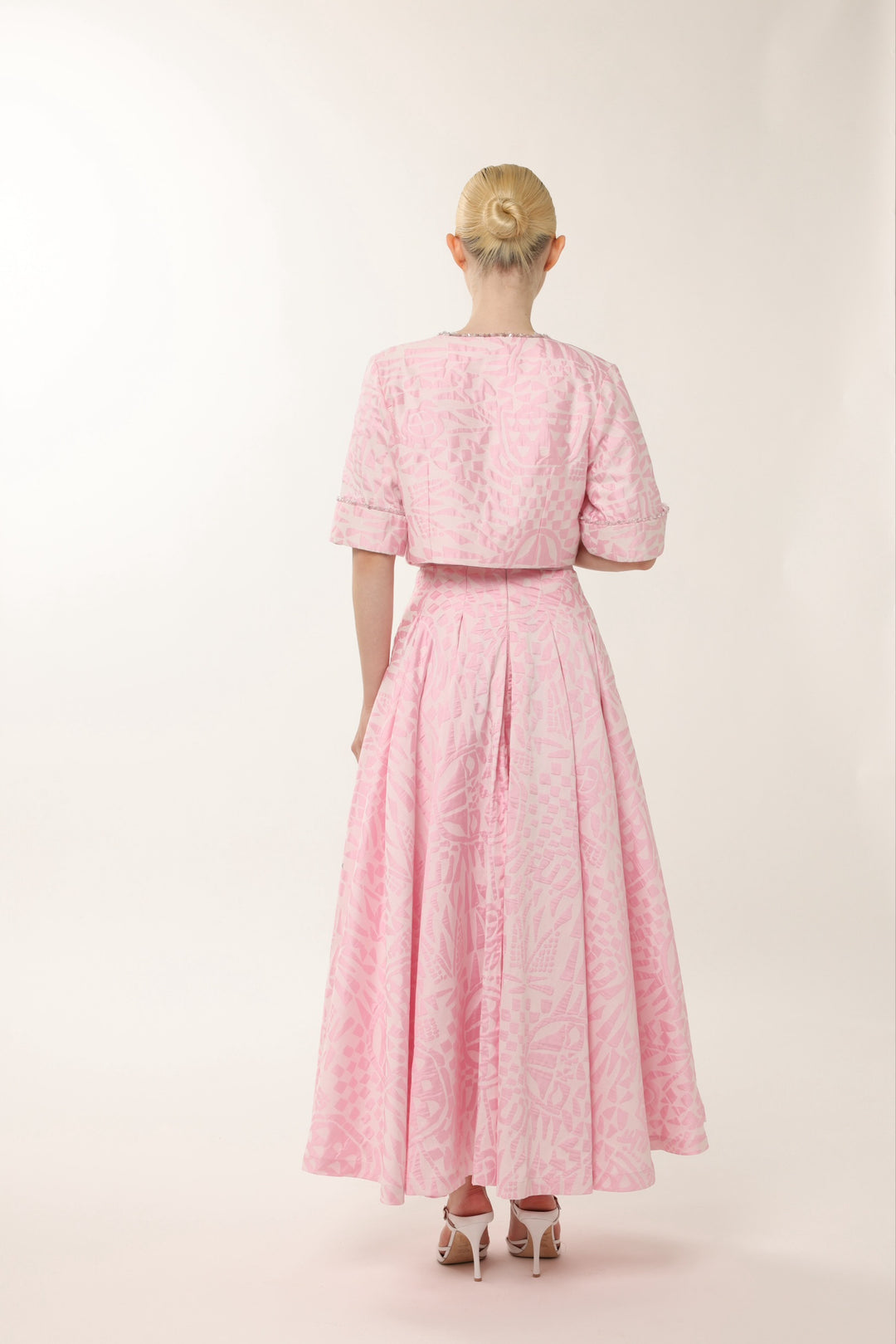 Pink designer occasion dress with flared silhouette and cropped jacket