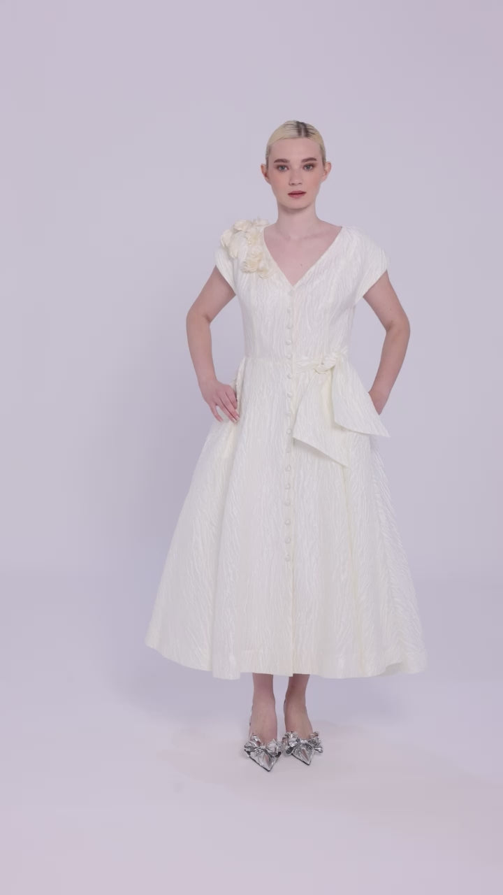 Feminine ivory cocktail dress with textured jacquard fabric