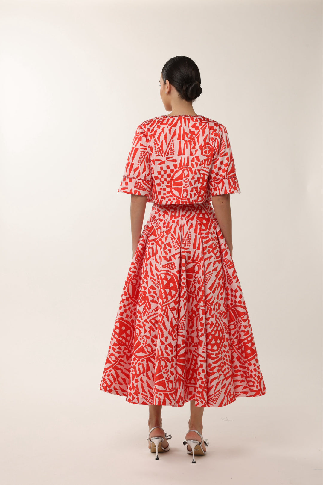 Elegant red wedding guest midi dress with beaded neckline