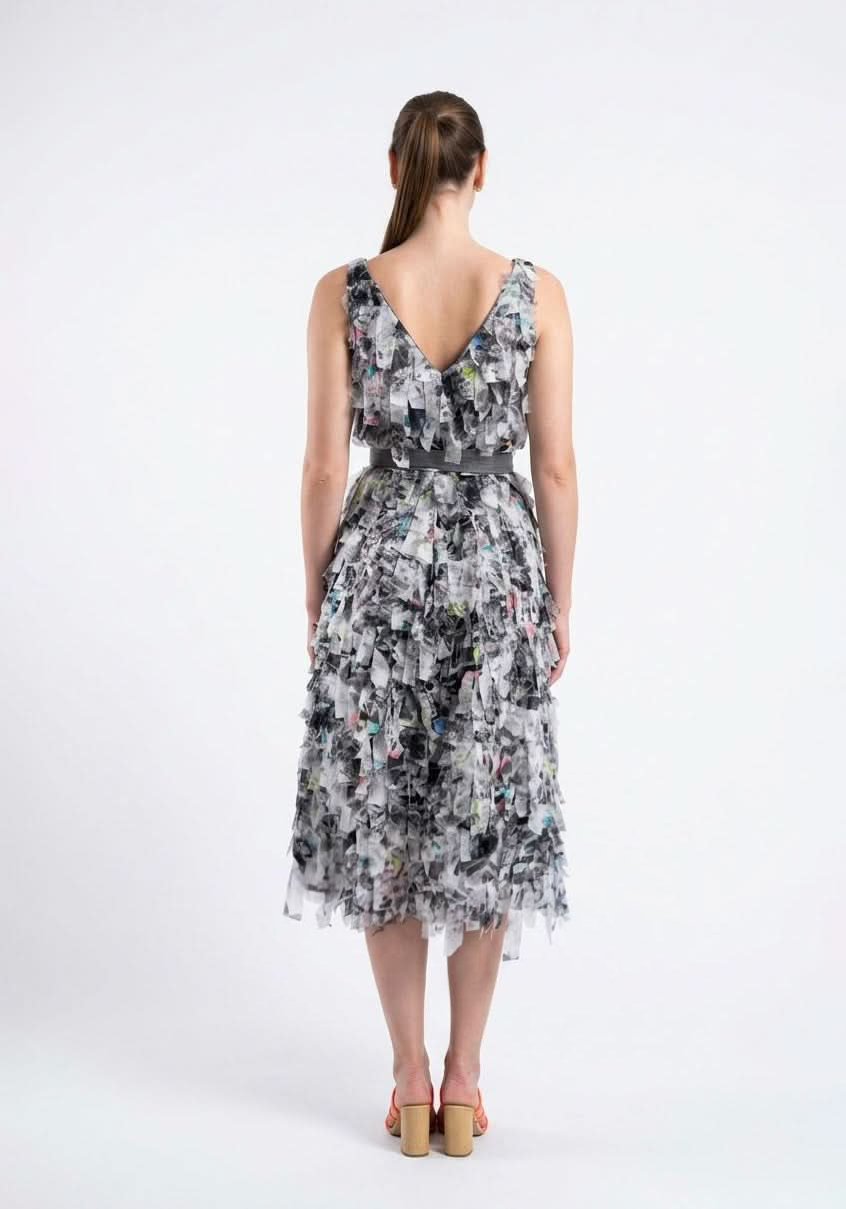 Back view of the Celosia Dress in an abstract grey and white print, showing the V back and the tie belt, by Baruni