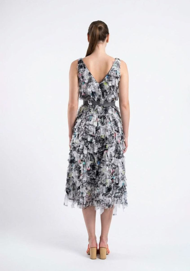 Back view of the Celosia Dress in an abstract grey and white print, showing the V back and the tie belt, by Baruni